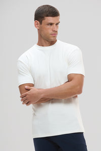 Camiseta Raiz Gola Média · Off Essência – Algodão Egípcio